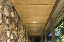 Exterior Walkway Remodel with Stained Wood Detail and Trim
